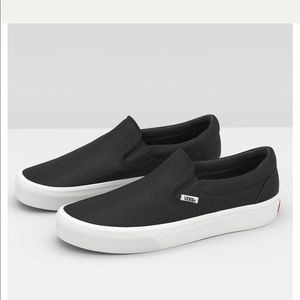 Vans black perforated leather classic slip-ons